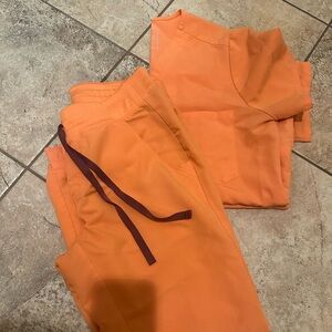 Figs Scrub set. Papaya in color. Top is Med from Technical collection.